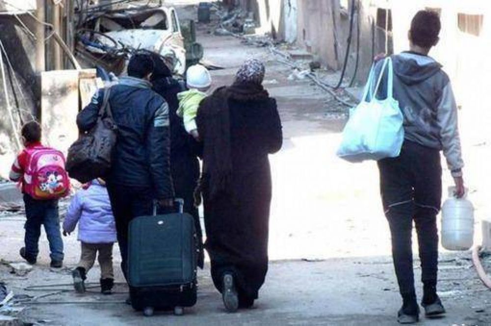 Los civiles regresan a una devastada Homs, ya sin insurgentes