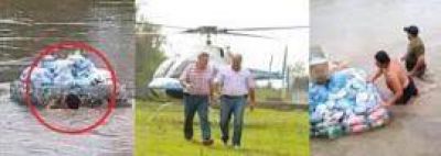 Manzur pasea en helic�ptero y no reparte ni una aceituna mientras los voluntarios llevan donaciones a nado