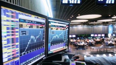 El menor ritmo de compra de divisas y el riesgo pa�s moderan la euforia financiera