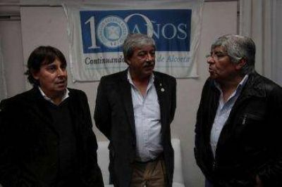 Micheli marcha con apoyo de Moyano y Buzzi