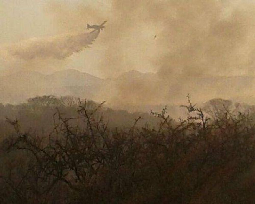Vecinos de El Volc�n aseguran que vieron a encapuchados prender fuego en las sierras