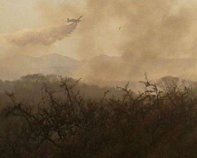 Vecinos de El Volc�n aseguran que vieron a encapuchados prender fuego en las sierras